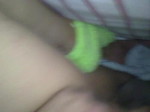 A beautiful Asian girl is relaxing in bed and giving a great blowjob
