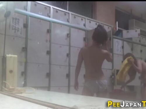Sexy asian girl pees in a public stairwell