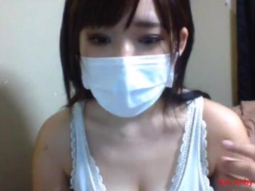 Cute Japanese hottie shows off her perky tits for the first time on cam