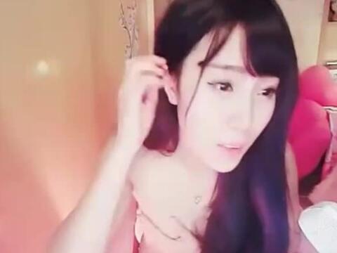 June plays with herself in front of the camera